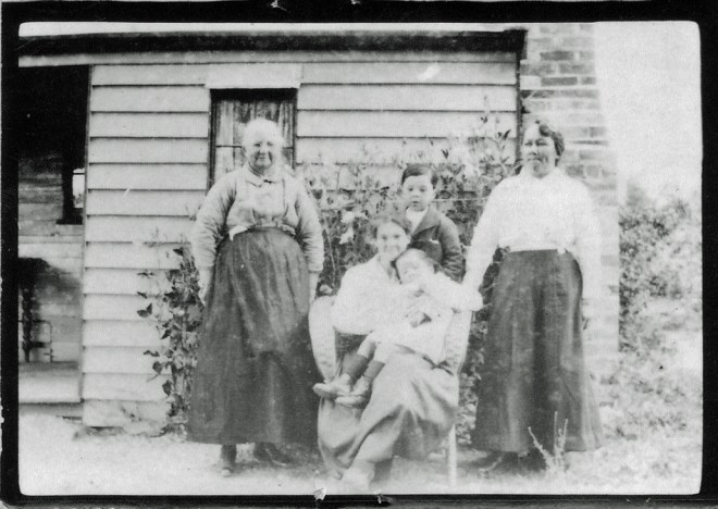 A welcoming home Elizabeth Ann Stewart (nee Ball) with her daughter Jane (seated), daughter-in-law Amelia Bruce Tan Loo Stewart and Amelia's children Clarence and Nellie Stewart